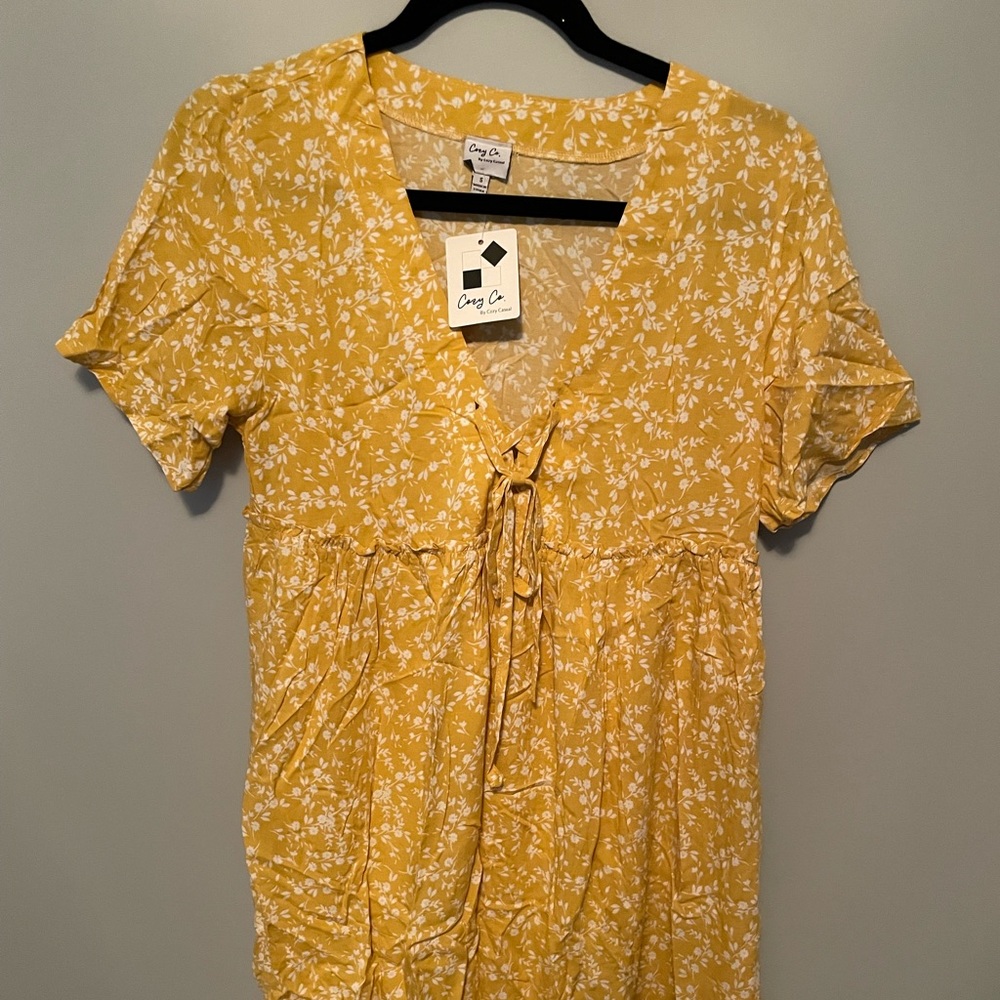 New with tags, small, floral printed dress with a v-neckline